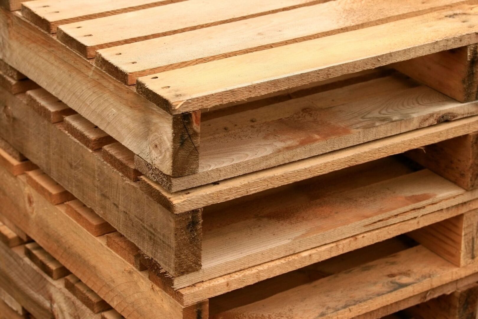 A stack of wooden pallets sitting next to each other.